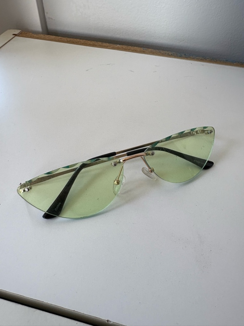 Green Rimless Cat Eye Sunglasses